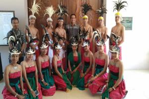 Bros. Yusuf Kuncoro and Blasius and student wearing traditional clothes