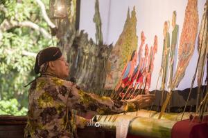 Bro. Frans Sugi performs "Wayang Wahyu".