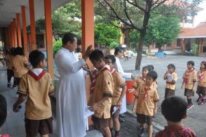Bro. Slamet and student in Semarang, Indonesia