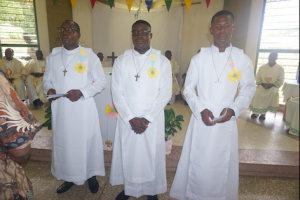 three newly professed brothers in Ghana Province